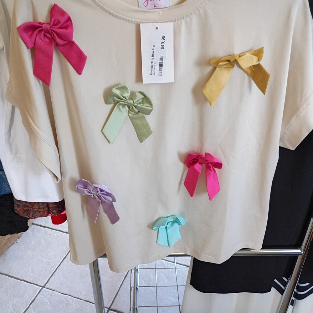 Cream Top with Multicolor Bows